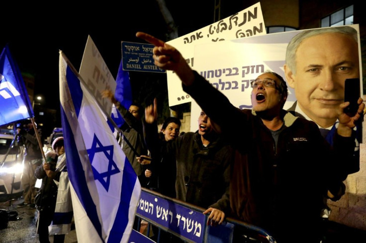 Supporters of Israeli Prime Minister Benjamin Netanyahu demonstrate their solidarity with him outside his official residency in Jerusalem late Thursday