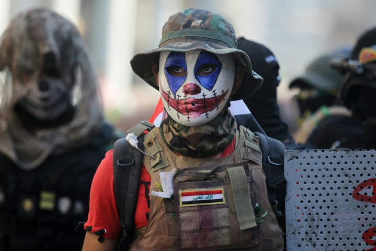 Anti-government protesters confront Iraqi security forces near Baghdad's Al-Ahrar bridge on November 22, 2019