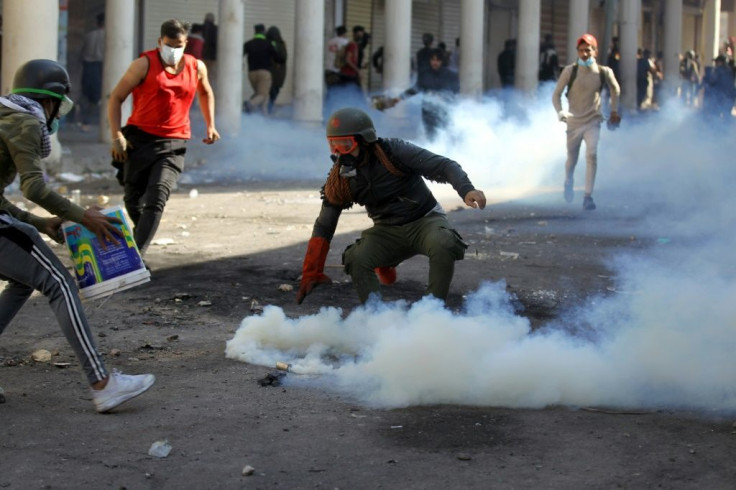 Protesters clash with Iraqi security forces near Al-Ahrar bridge in Baghdad on November 22, 2019