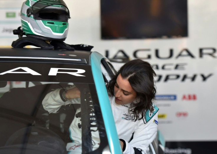 Saudi Arabia's first female racing driver Reema al-Juffali steps into her electric car ahead of the Jaguar I-PACE eTROPHY