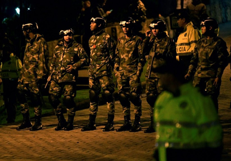 Security forces take position during a protest in front of the house of Colombia's President Ivan Duque, in Bogota, on November 22, 2019