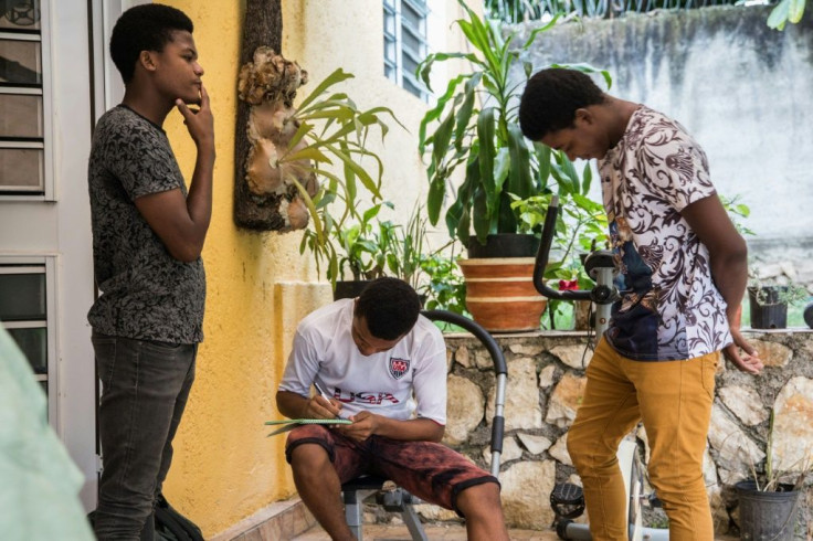 The Bosquet brothers -- Evensky, 18 (L), Reevens, 20 (C), and Valens, 22 -- are staying at a cousin's house because their neighborhood is riddled with crime, and have fallen behind with their schooling