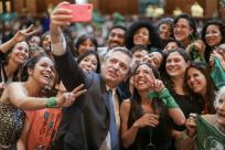 Argentina's president-elect Alberto Fernandez (center) poses for a selfie with women bearing green scarves -- the symbol of activists demanding the right to abortion -- in Buenos Aires on November 14, 2019 in a handout photo