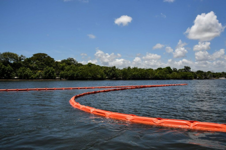 Floating barriers contain oil spilled near mangroves in Cabo de Santo Agostinho, Pernambuco state in October 2019