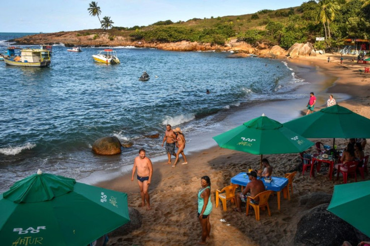 Tourists are seen on Calhetas beach in Pernambuco state in October 2019