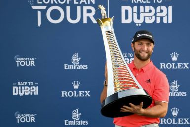 Jon Rahm of Spain poses with the trophy after winning the Final of the Dubai DP World Tour Championship