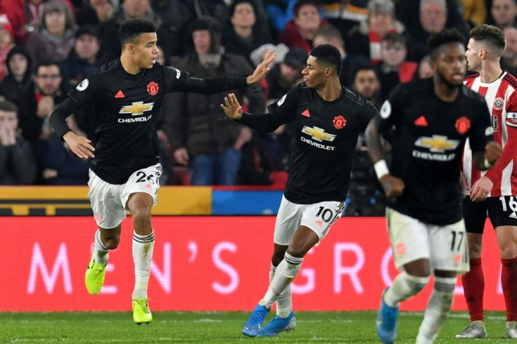 Manchester United forward Mason Greenwood (left) celebrates his goal against Sheffield United