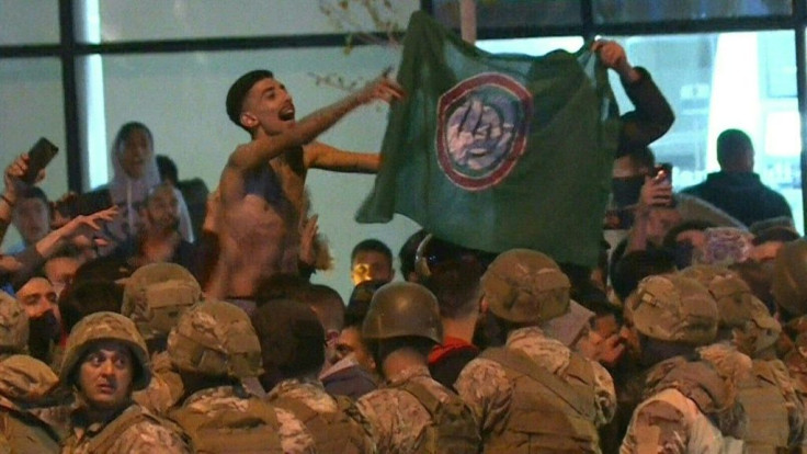 Lebanese army soldiers and riot police are deployed amid clashes between anti-government demonstrators and supporters of the Shiite movements Hezbollah and Amal in downtown Beirut. Shortly before midnight supporters of the Lebanese Shiite groups attacked 