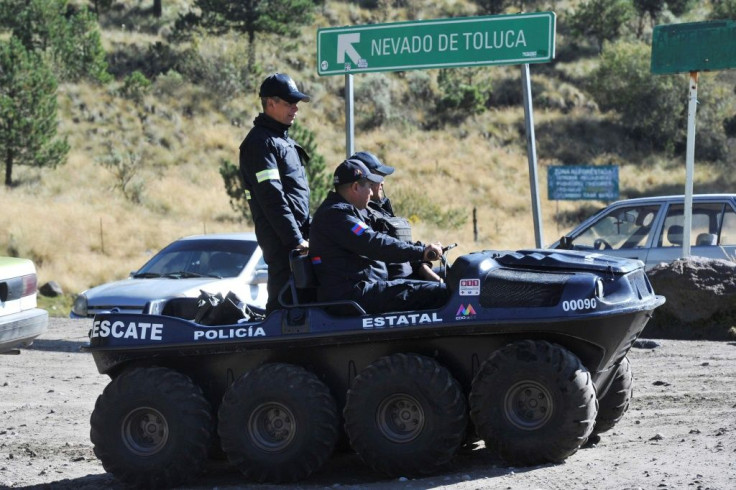Police agents of Mexico State patrol the roads that lead to the crater of the Xinantecatl volcano (Nevado de Toluca), southwest of Toluca, on November 25, 2019 in search of a kidnapped French citizen and Mexican national