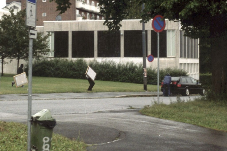 In this police photo, armed thieves are pictured fleeing the scene after robbing the Munch Museum in Oslo on August 22, 2004