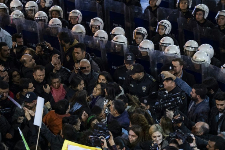 Riot police in Istanbul blocked the path of roughly 2,000 protesters before firing tear gas and plastic bullets to disperse them