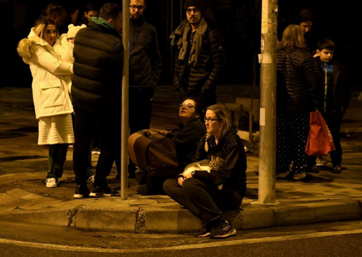 Residents gathered outdoors in Tirana