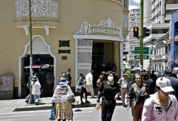 People walk in La Paz on November 25