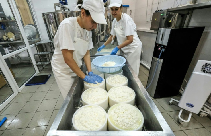 'Cheese & Beer' co-owner Elvira Kovtun working with her assistant Liza at their creamery in the industrial town of Korolyov. The site is a far cry from Elvira's suburban Moscow kitchen, where she began making cheese.