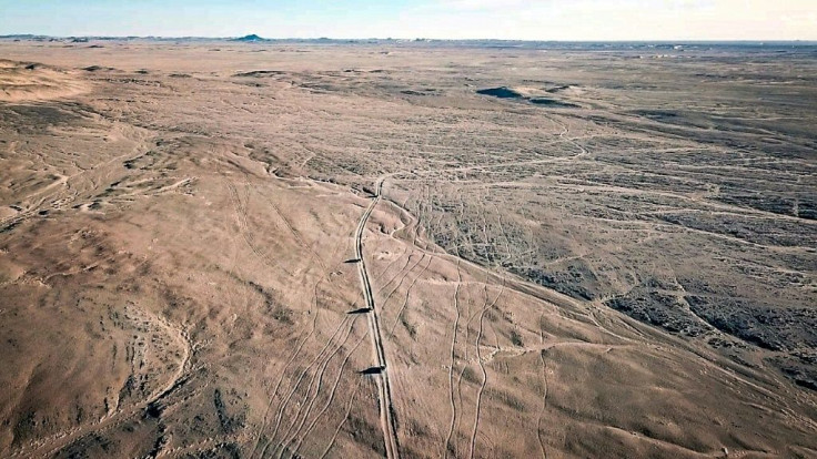 January 2019: A convoy of pickup trucks carrying migrants crosses the Air Desert in northern Niger, heading towards the Libyan border post of Al Qatrun