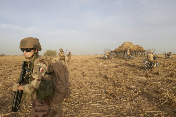 A soldier of the French Army patrols a rural area during the Barkhane operation in northern Burkina Faso on November 9, 2019.
