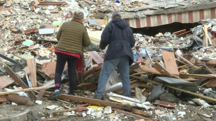 IMAGESRescue workers are looking for survivors in the rubble of a collapsed building in Durres, and have set up aid distribution points for families displaced by an earthquake that killed almost 30 people in Albania.