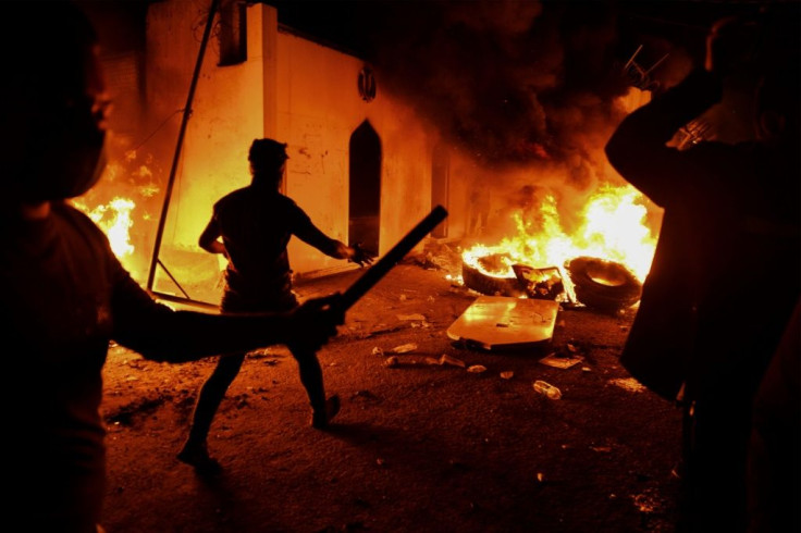 Iraqi demonstrators outside Iran's consulate after setting the building in the southern Shiite holy city of Najaf alight on Wednesday