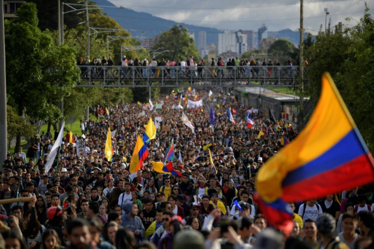 Tens of thousands march against the government of Colombian President Ivan Duque during a national strike in Bogota Wednesday