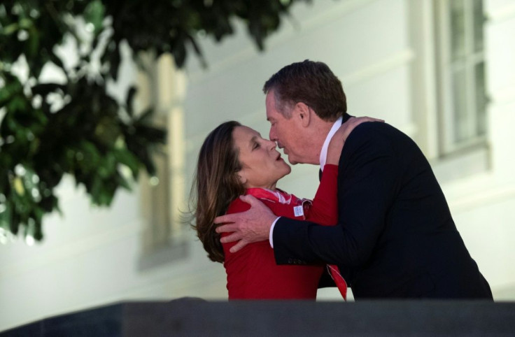 Normally media-shy US Trade Representative Robert Lighthizer warmly greets Canadian Deputy Prime Minister Chrystia Freeland as she arrives at talks on the US-Mexico-Canada Agreement (USMCA)