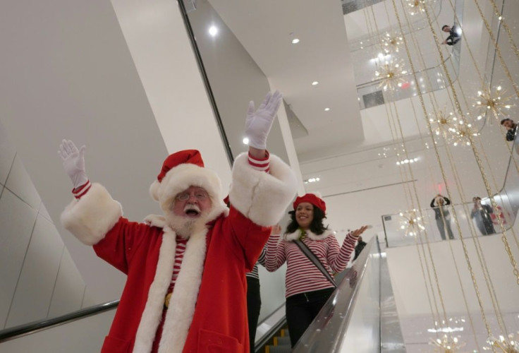Santa Claus arrives down the escalator at New York City's first-ever women's Nordstrom, which opened last month