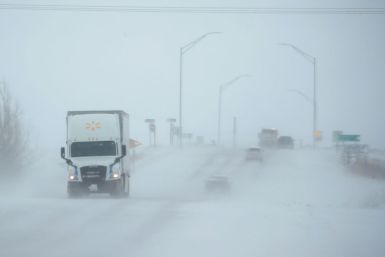 Snow blows across a road on November 27, 2019 near Rudd, Iowa