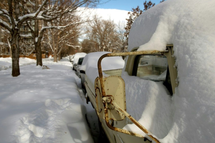 Tens of thousands were without power in the United States by a pair of storms packing heavy snow and hurricane-force winds