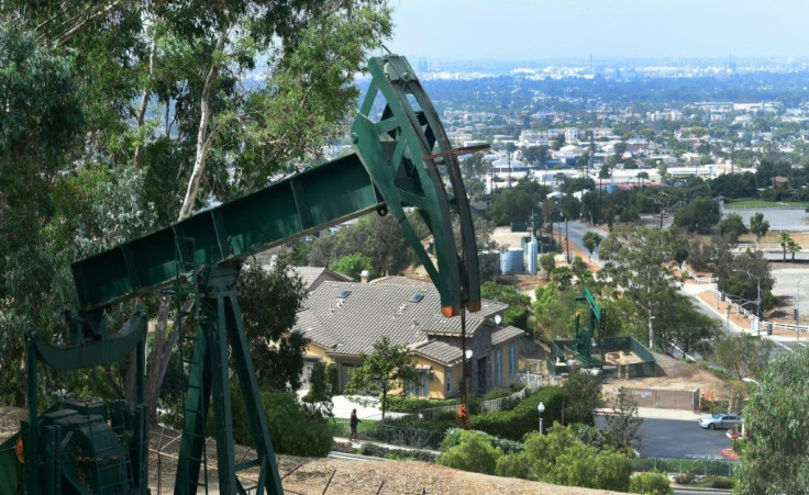 Pumpjacks in an oil well are seen on September 25, 2019 near Hilltop Park overlooking the city of Signal Hill, California, where oil has been pumped since the 1920s