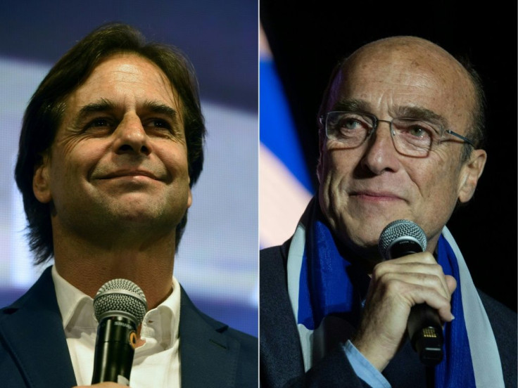 Luis Lacalle Pou (L) of the Partido Nacional party became Uruguay's next president after Daniel Martinez with the ruling Frente Amplio (Broad Front) party conceded