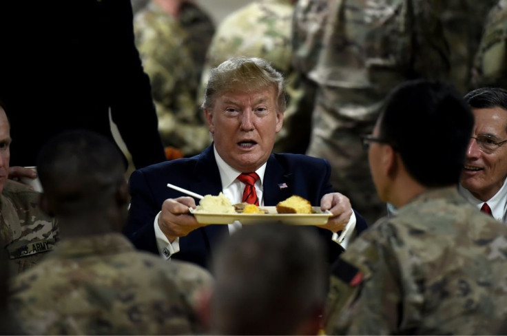 US President Donald Trump serves Thanksgiving dinner to US troops at Bagram Air Field during a surprise visit on November 28, 2019 in Afghanistan