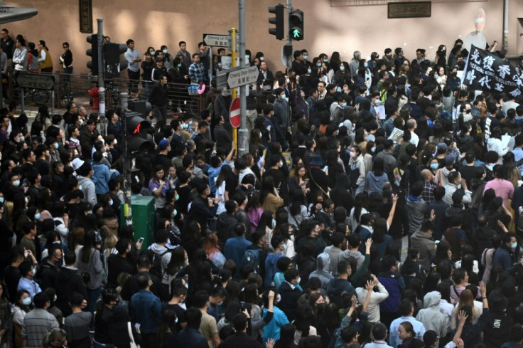 People attend a lunchtime flash mob rally in Hong Kong