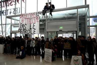 Activists formed a human chain to protest Black Friday sales at a shoping mall in the La Defense business district west of Paris, France, on Friday.