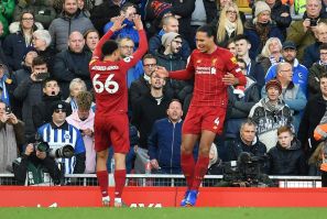 Double Dutch: Virgil van Dijk (right) scored both Liverpool's goals in a 2-1 win over Brighton