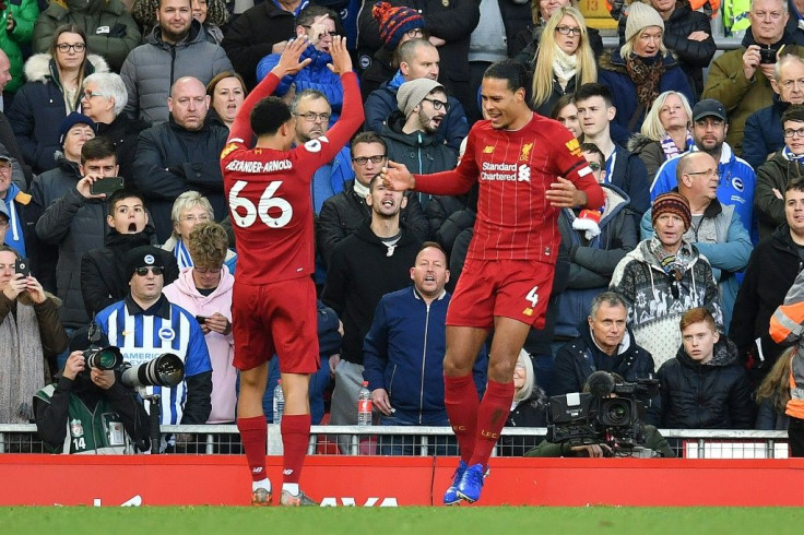 Double Dutch: Virgil van Dijk (right) scored both Liverpool's goals in a 2-1 win over Brighton