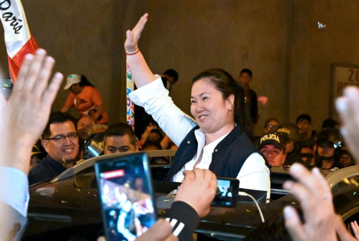 Peruvian politician Keiko Fujimori waves to supporters as she is released from prison in Lima on November 29, 2019