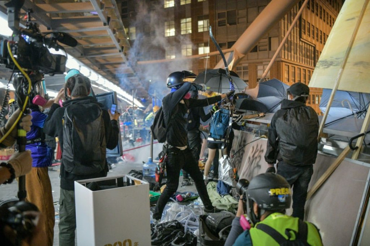 Protesters wielding petrol bombs and bows and arrows in their battles with police