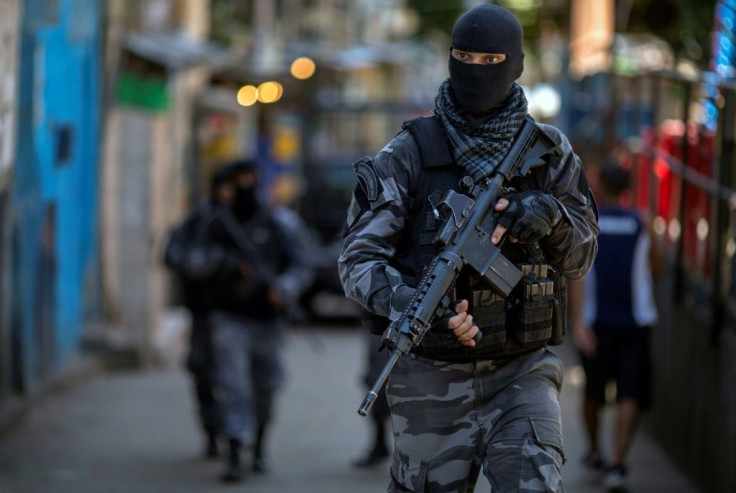 Heavily armed police often carry out operations in the poorer neighborhoods of Brazil, as shown in this 2018 photo from Rio de Janeiro
