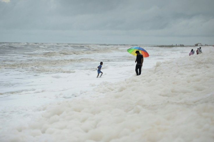 Word of the risks have not got through to the hundreds of families who throng India's longest urban beach, letting children happily skip in the toxin-filled froth