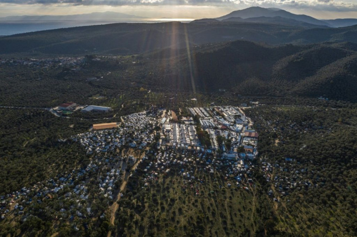 Greece's prime minister has said three of the most overpopulated camps will close