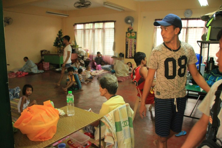 Residents rest inside a classroom used as a temporary shelter in Legaspi City, Albay province, south of Manila