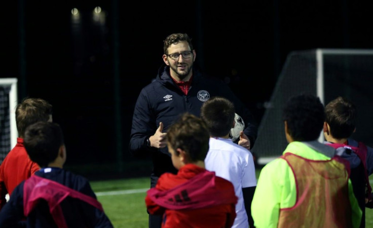 Deaf football coach Ben Lampert takes a training session in west London