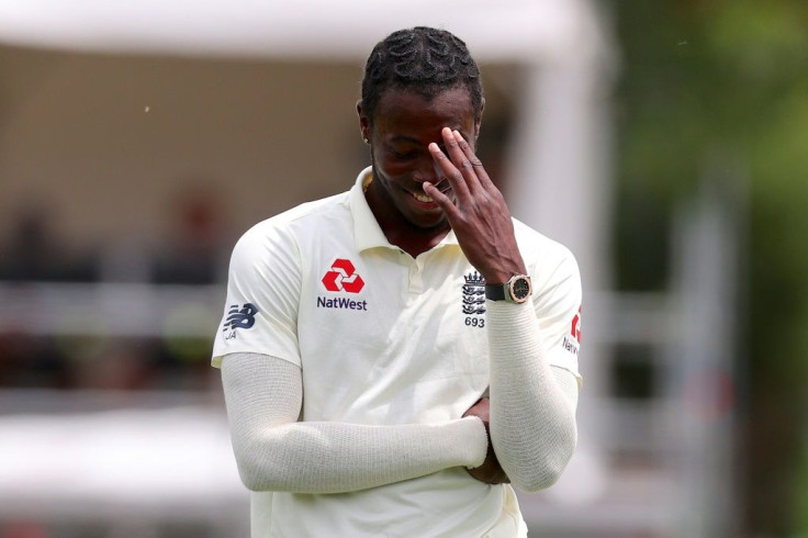 England's Jofra Archer reacts after Joe Denly dropped an easy catch off Kane Williamson