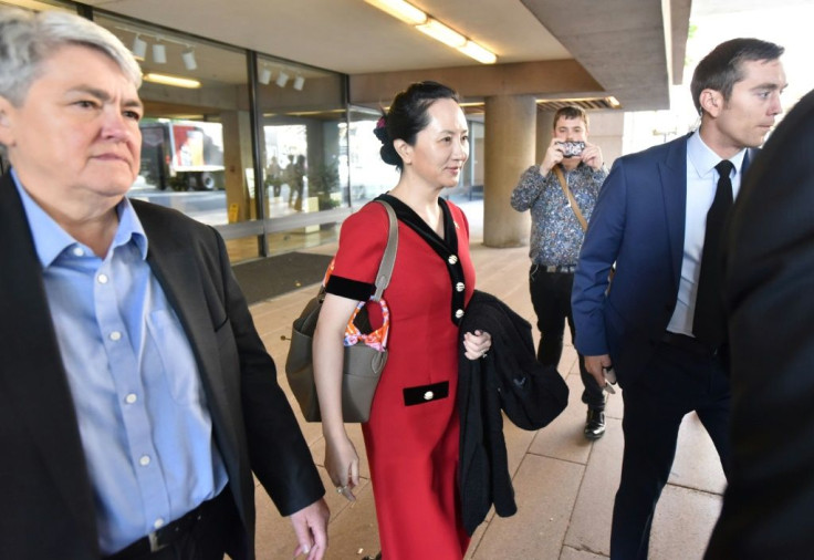 Huawei chief financial officer Meng Wanzhou (C) was arrested in 2018 during a flight stopover in Vancouver on a US warrant alleging violations of sanctions against Iran