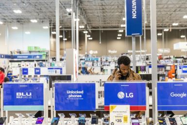 A Black Friday shopper looks at cellular phones at a California Best Buy store on "Black Friday," part of a strong open to the holiday shopping season
