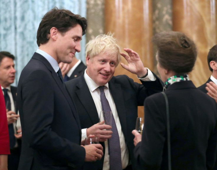 Britain's Princess Anne talks to Britain's Prime Minister Boris Johnson, Canada's Prime Minister Justin Trudeau and other NATO leaders at Buckingham Palace