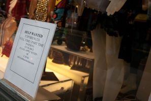 A 'help wanted' sign in the window of Add Accessories in New York City