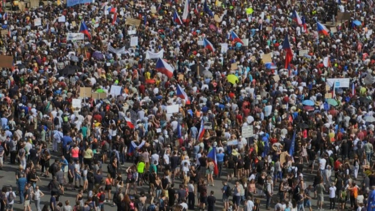 Huge crowds flooded central Prague on Sunday demanding Prime Minister Andrej Babis step down over corruption allegations in a protest that organisers and local media claim drew around 250,000 people, making it the largest since the fall of communism in 19