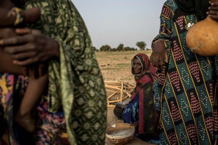Women of the Wodaabe, one of the groups that make up the Fulani ethnicity, prepare breakfast