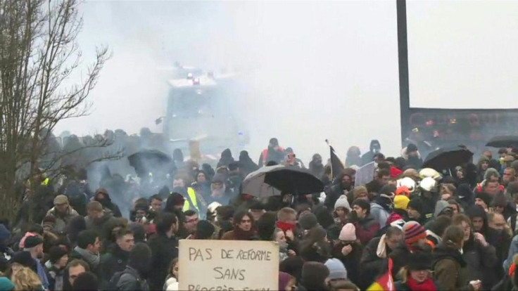 Brief clashes between demonstrators and police broke out on the fringes of a demonstration in Nantes, part of a massive protest  against a pension overhaul by President Emmanuel Macron