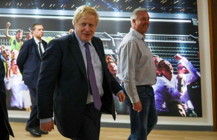 Britain's Prime Minister Boris Johnson during a Conservative Party general election campaign visit to Red Bull Racing in Milton Keynes. Feeling confident he has already published his plans for his first 100 days in office
